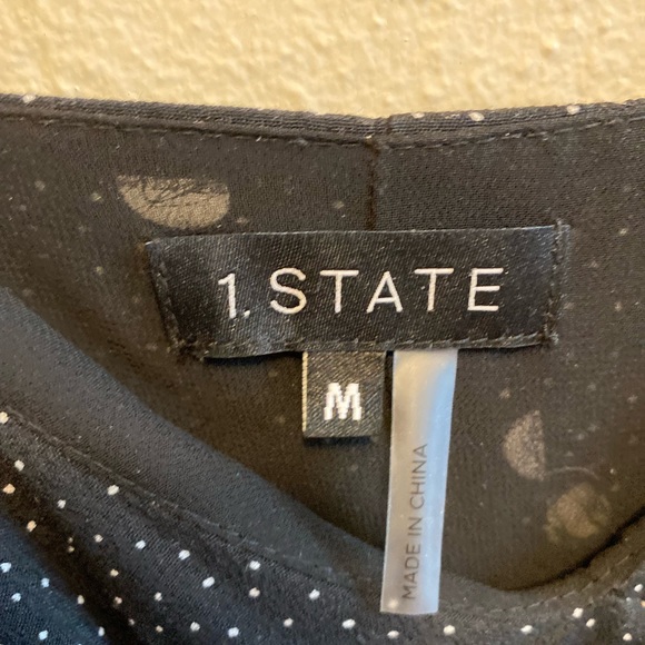 Black and white polka dot dress with ruffle front. - Picture 4 of 5